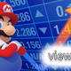 Mario standing in front of a blue screen of numbers with a yellow arrow pointing up over the word viewers.